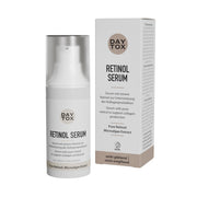 Weißes Daytox Retinol Serum Fläschchen und beige-weiße Produktverpackung auf hellem Hintergrund.