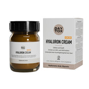 Braunes Glastiegel Daytox Hyaluron Cream LSF20 und beige Produktverpackung nebeneinander.